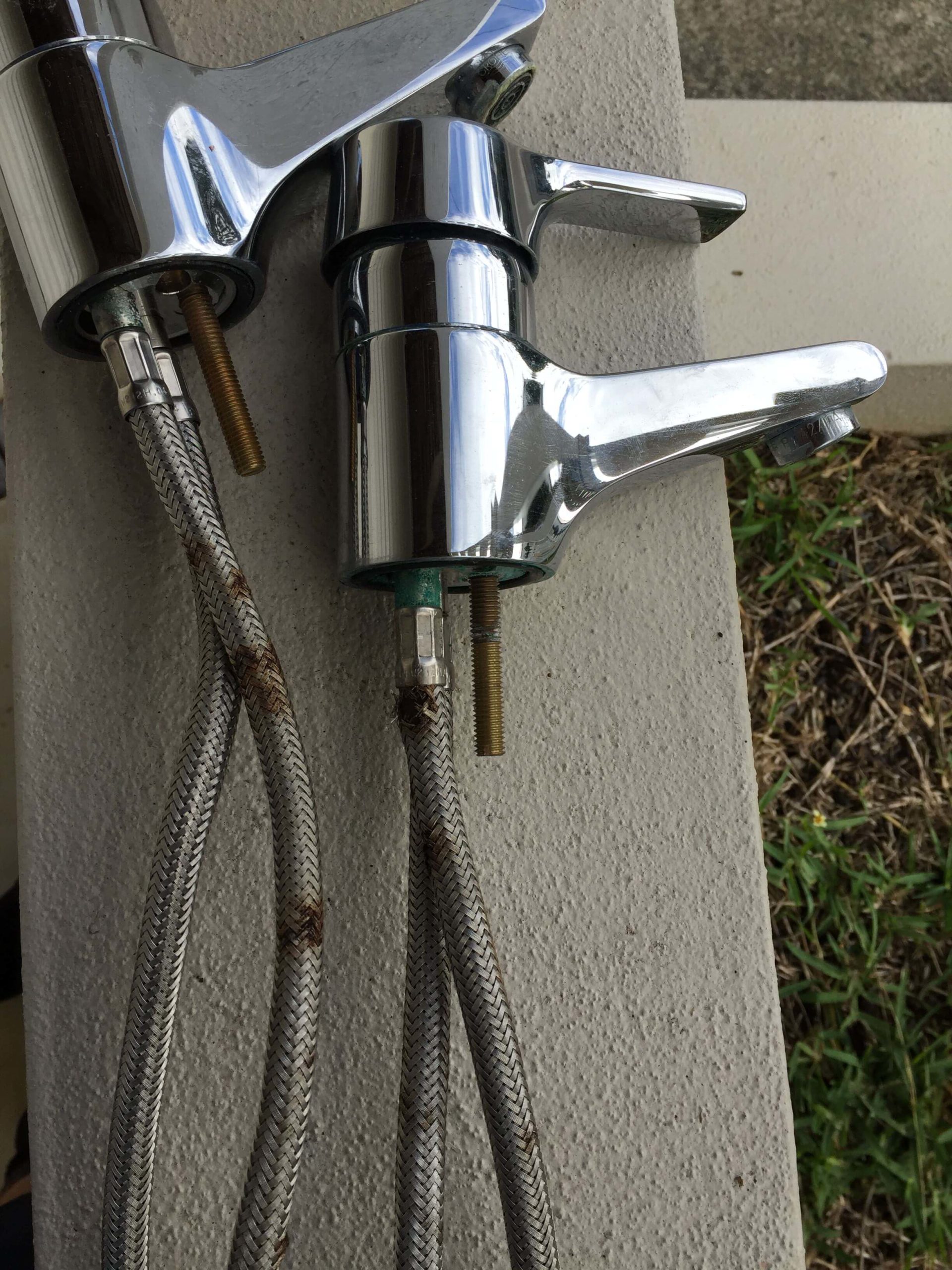 picture of two old stainless steel taps